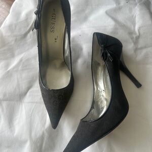 Woman, pointy designer shoes. Guess